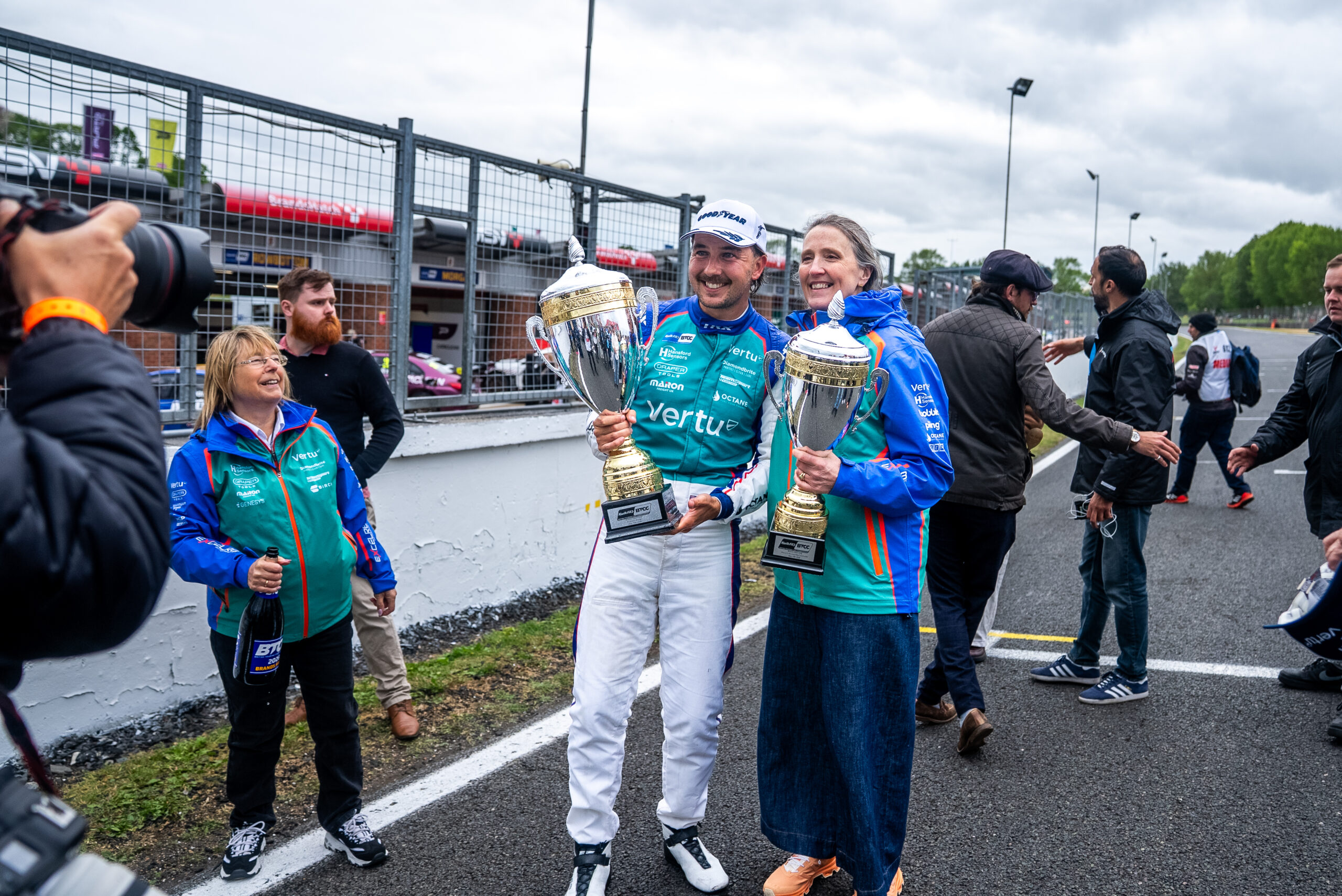 Marketing on page image 2 Tom Ingram celebrating a win with the team at brands hatch
